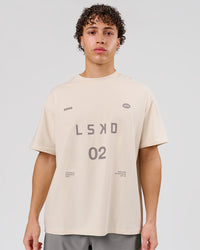 Man wearing Game Plan Heavyweight FLXCotton Oversized Tee - Vanilla Bean | Model:Leandro | Size:M | Thumbnail Index: 0