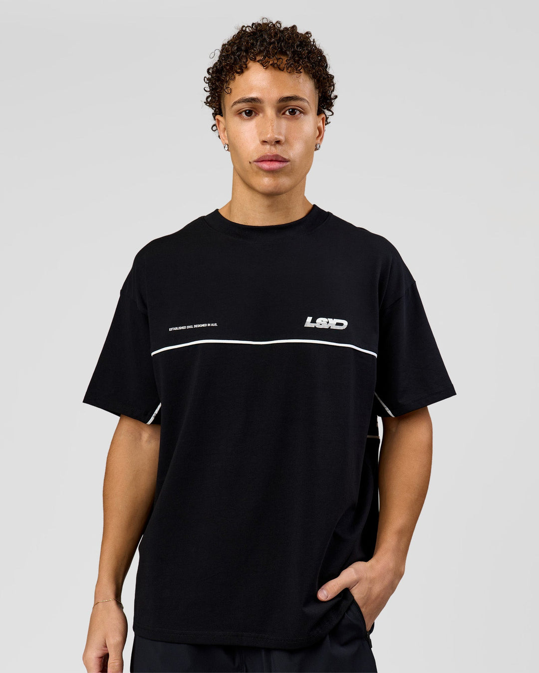 Man wearing Inline Heavyweight FLXCotton Oversized Tee - Black-White | Model:Leandro | Size:M - view 5