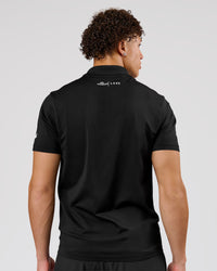 Man wearing Movember x LSKD Drive Seamless Polo - Black | Model:Leandro | Size:M | Thumbnail Index: 5