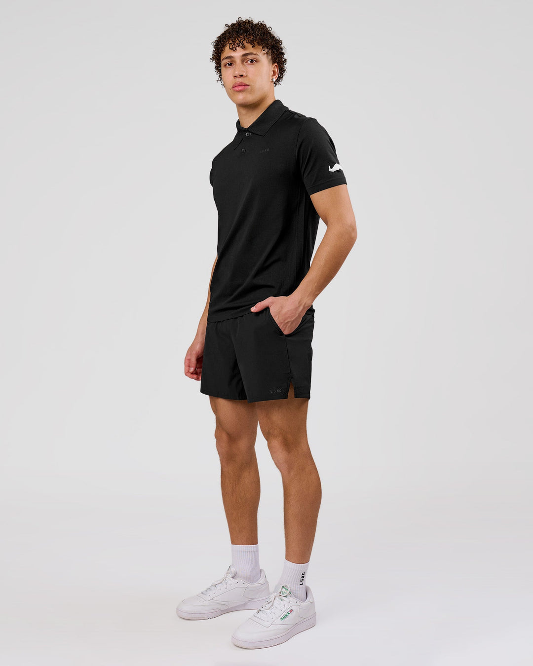 Man wearing Movember x LSKD Drive Seamless Polo - Black | Model:Leandro | Size:M - view 7