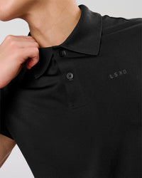 Man wearing Movember x LSKD Drive Seamless Polo - Black | Model:Leandro | Size:M | Thumbnail Index: 8