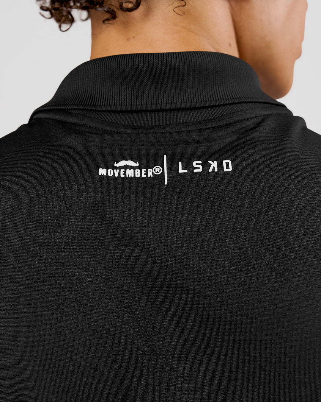 Man wearing Movember x LSKD Drive Seamless Polo - Black | Model:Leandro | Size:M - view 10