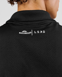 Man wearing Movember x LSKD Drive Seamless Polo - Black | Model:Leandro | Size:M | Thumbnail Index: 9