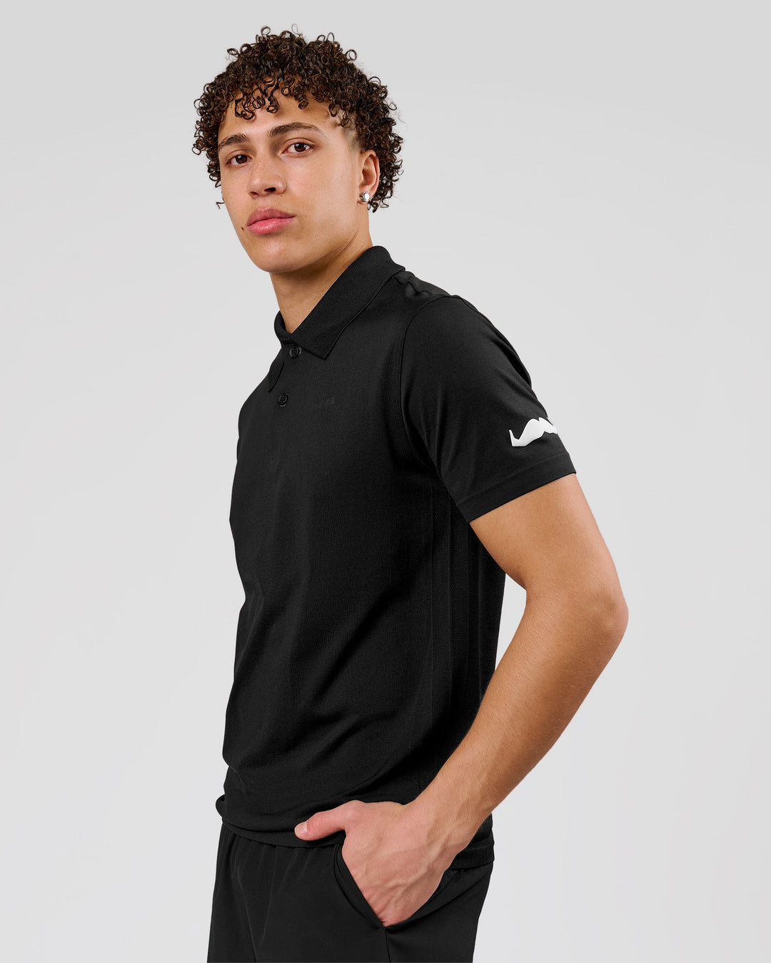 Man wearing Movember x LSKD Drive Seamless Polo - Black | Model:Leandro | Size:M - view 12
