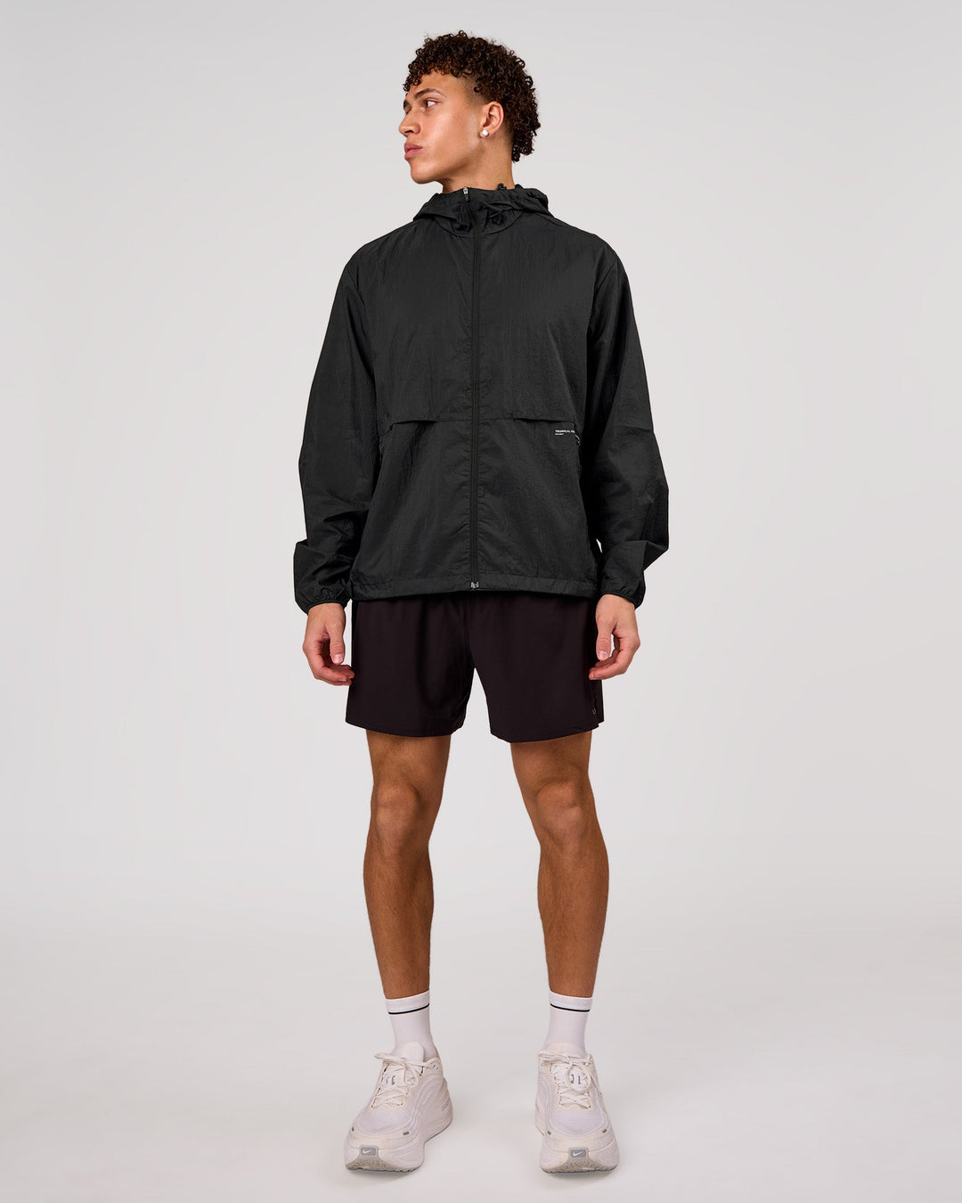 Man wearing Pace+ Lightweight Running Jacket - Black | Model:Leandro | Size:M - view 3