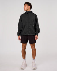 Man wearing Pace+ Lightweight Running Jacket - Black | Model:Leandro | Size:M | Thumbnail Index: 2