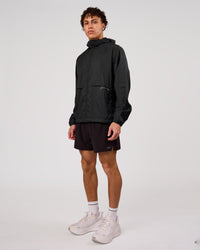 Man wearing Pace+ Lightweight Running Jacket - Black | Model:Leandro | Size:M | Thumbnail Index: 6