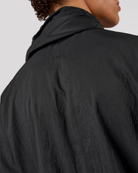 Man wearing Pace+ Lightweight Running Jacket - Black | Model:Leandro | Size:M | Thumbnail Index: 7