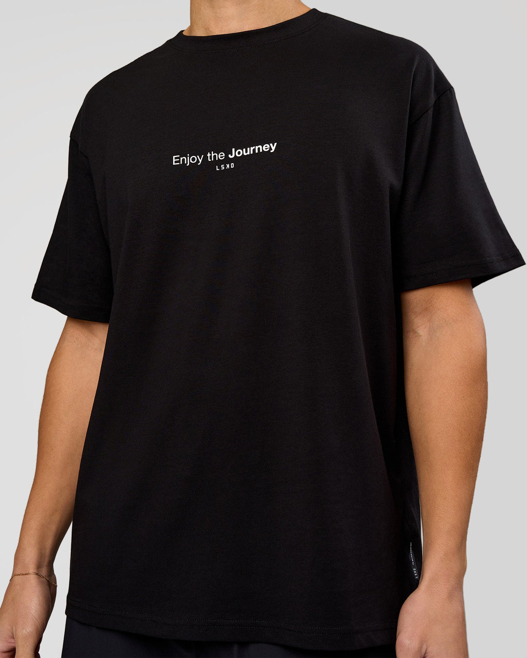 Man wearing VS1 Enjoy The Journey FLXCotton Oversize Tee - Black | Model:Leandro | Size:M - view 10