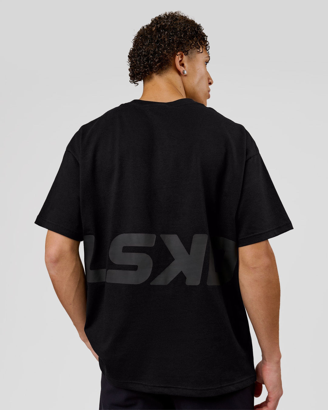 Man wearing Shadow Mark Heavyweight Oversized Tee - Black-Onyx | Model:Leandro | Size:M - view 2