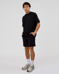 Man wearing Shadow Mark Heavyweight Oversized Tee - Black-Onyx | Model:Leandro | Size:M | Thumbnail Index: 13