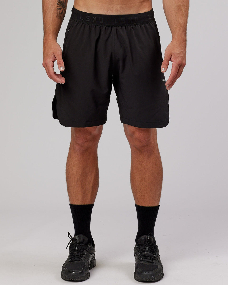 Man wearing Competition 8" Performance Short - Black