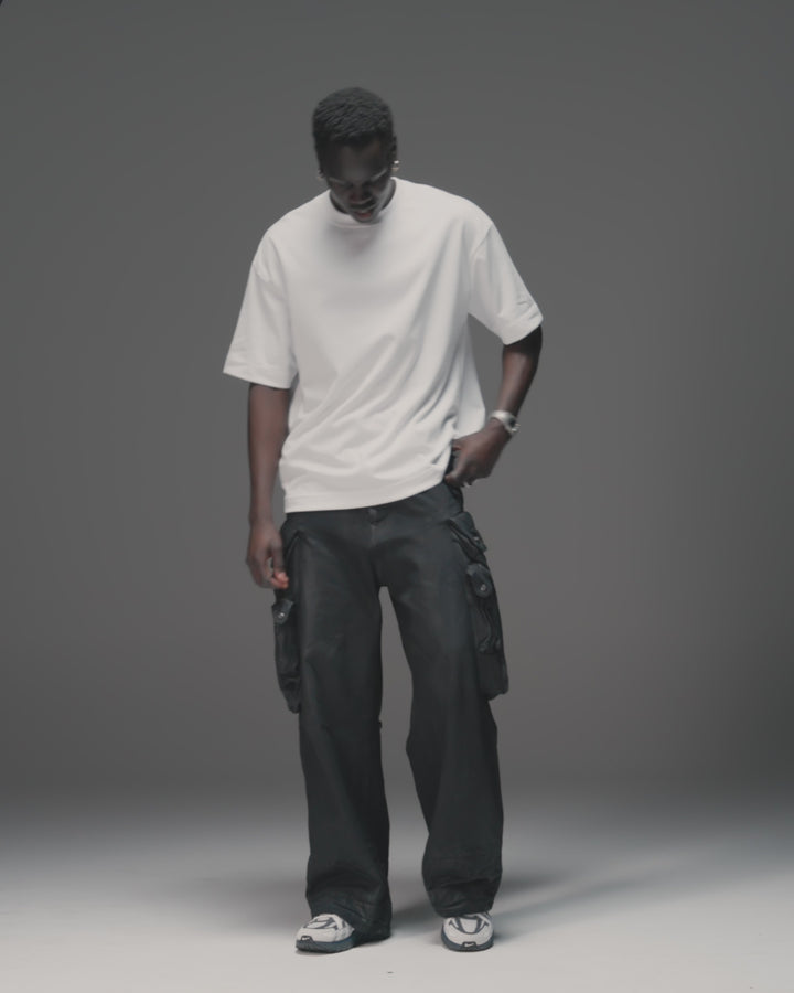 Man wearing AfterDark ZeroCrease Oversized Tee - White | Model:Mabyro | Size:M