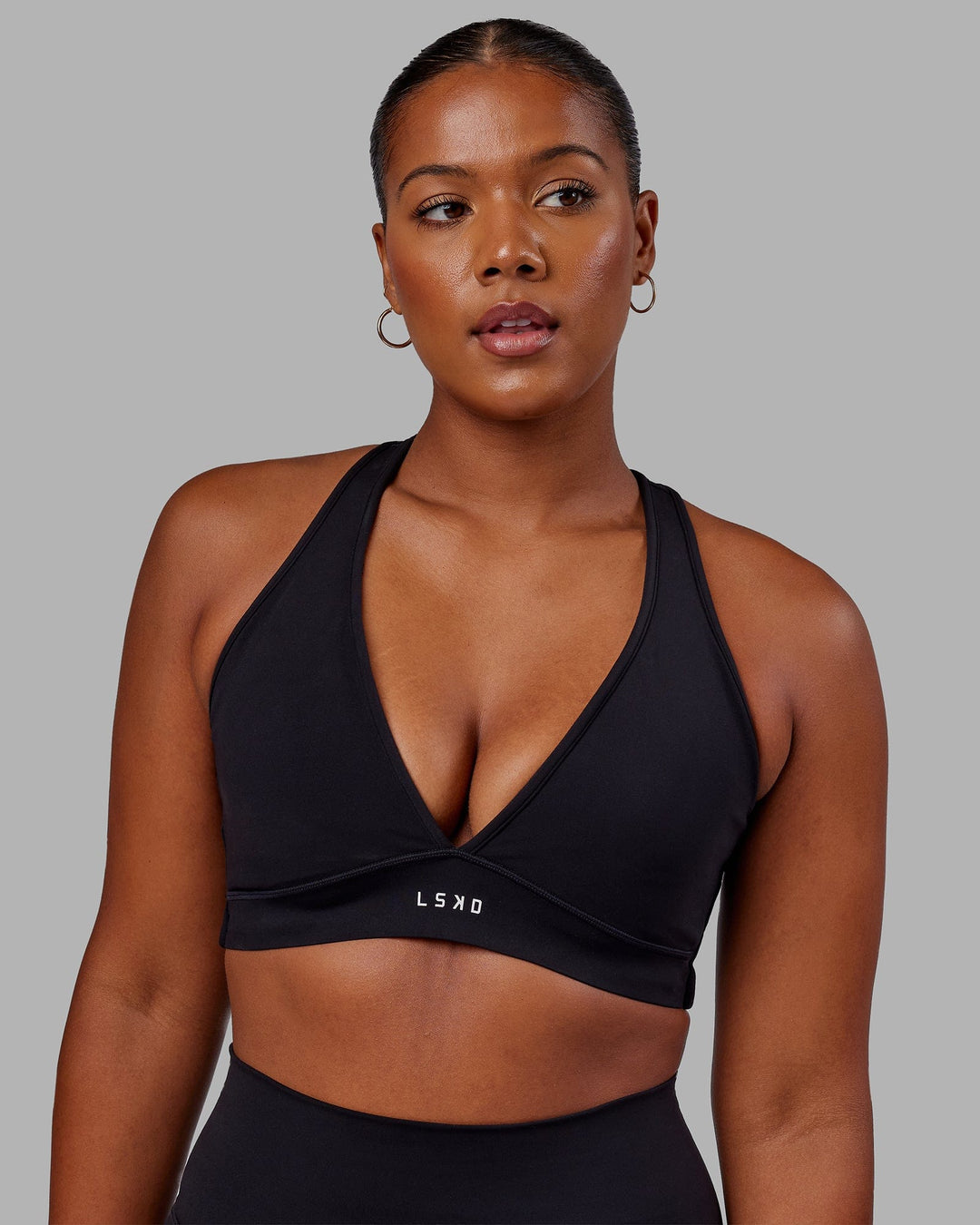 Woman wearing Stamina Sports Bra in Black | Size:L