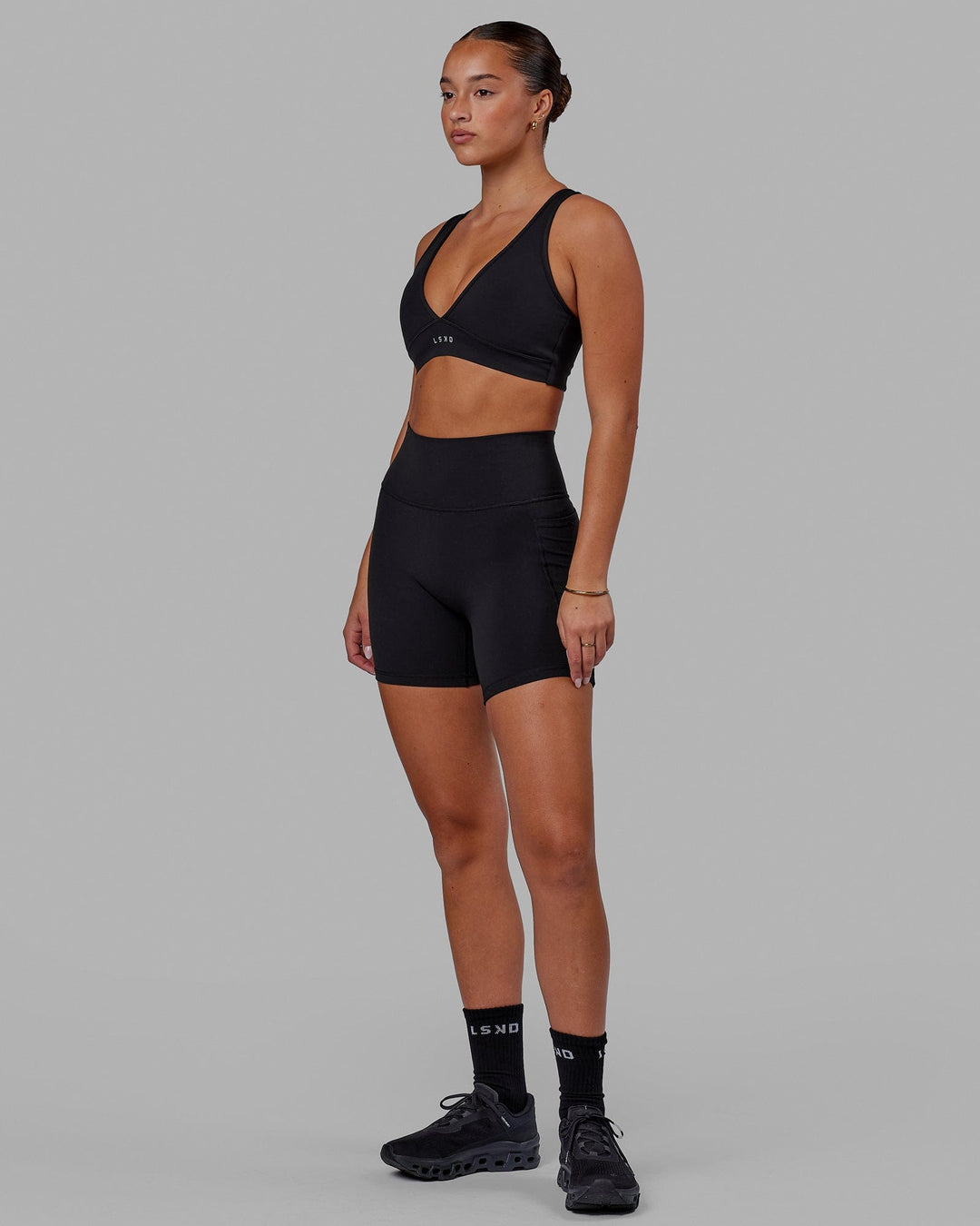 Woman wearing Stamina Sports Bra in Black | Size:S