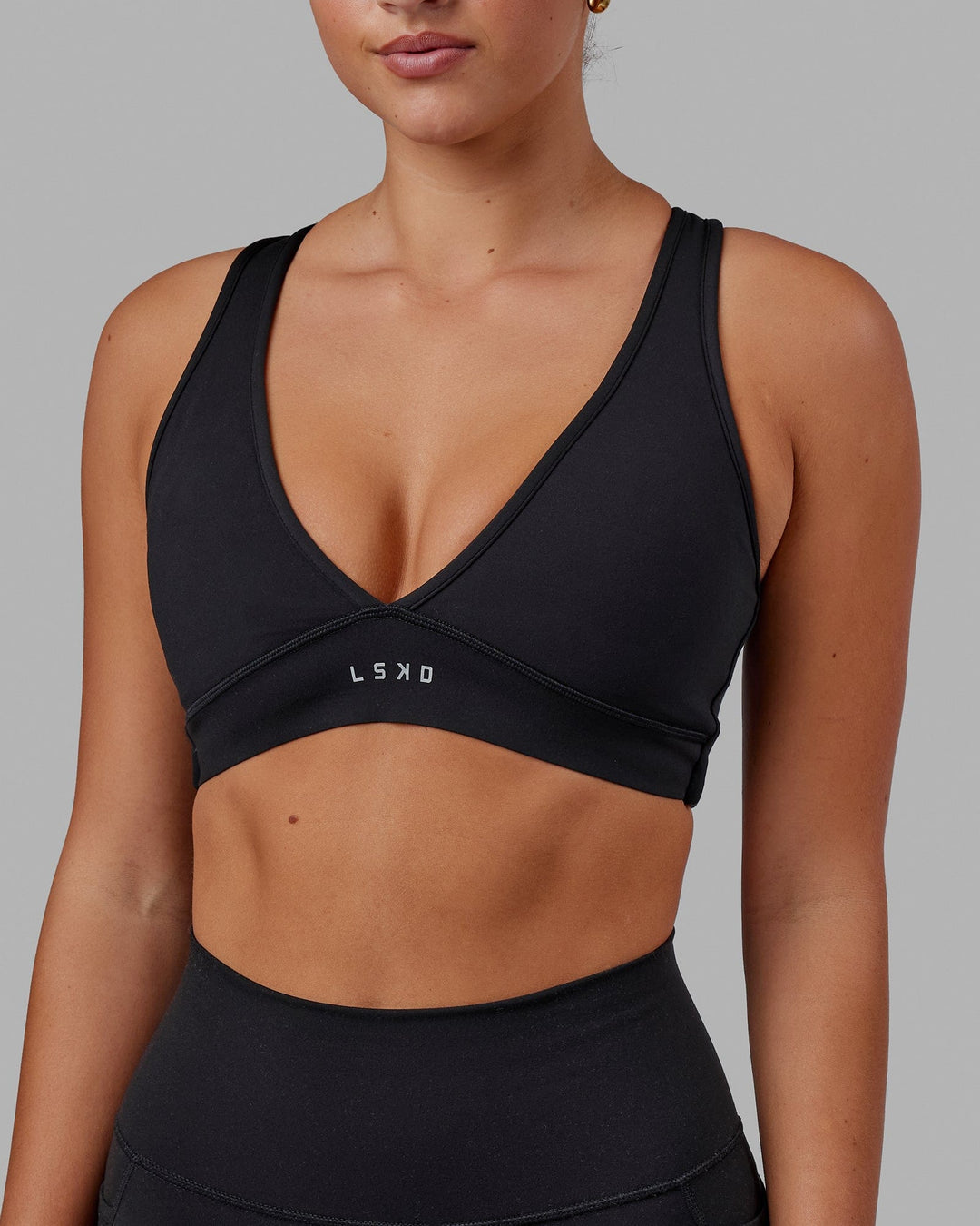 Woman wearing Stamina Sports Bra in Black | Size:S