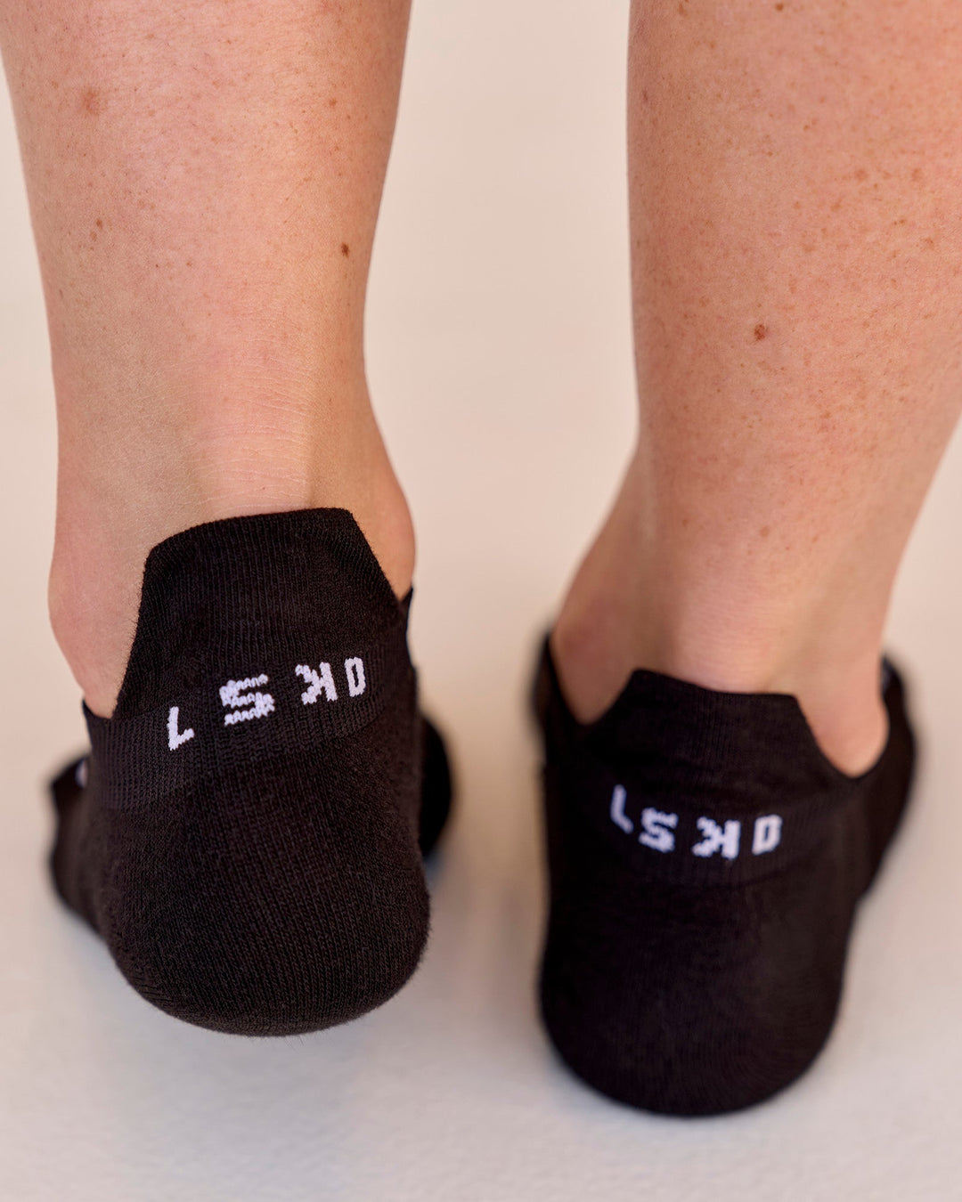 Studio image of Accelerate Performance Ankle Socks - Black-White - view 2