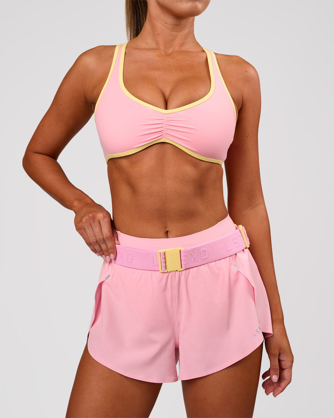 Studio image of Accelerate Run Belt - Lemon-Pink Rose - view 3