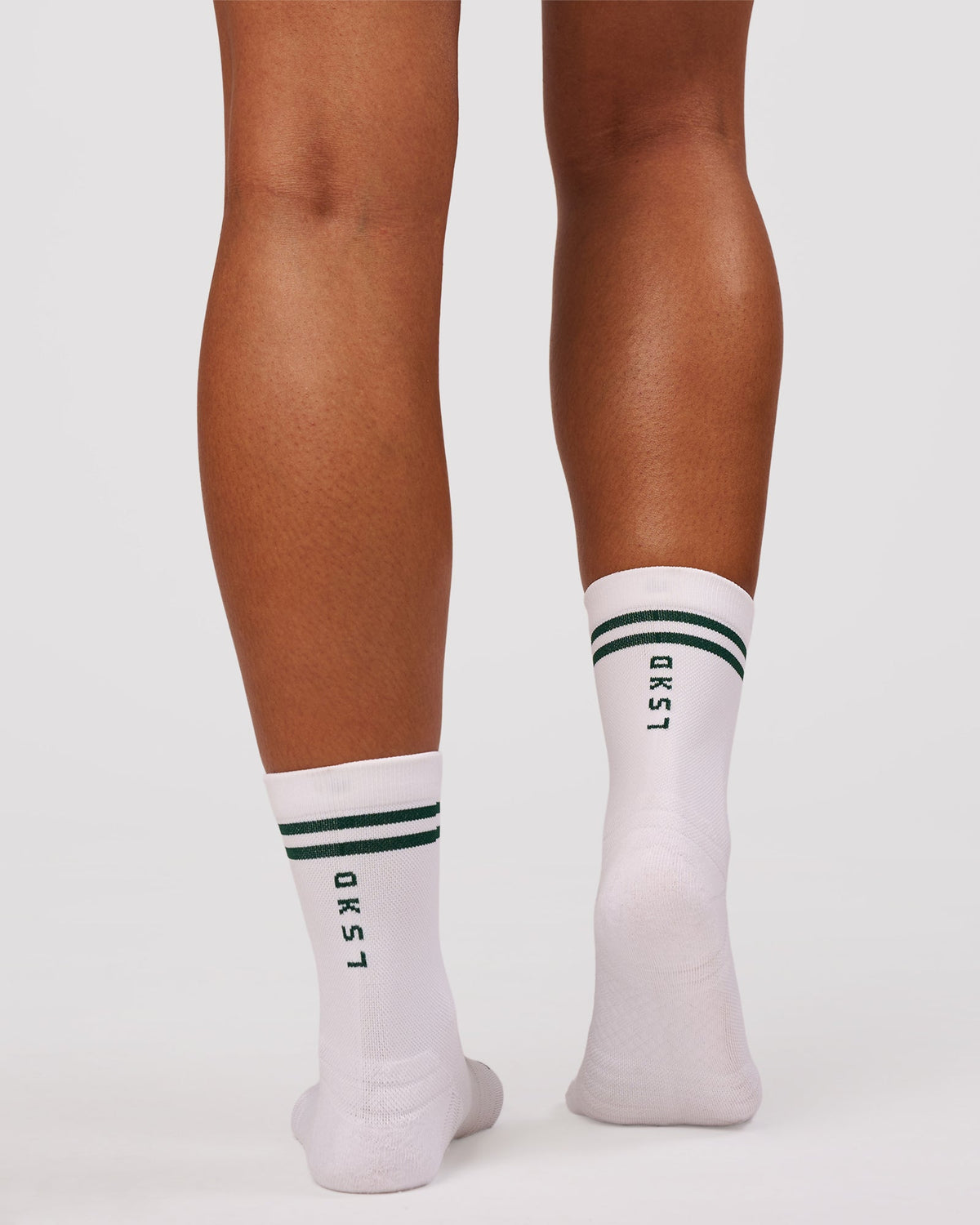 Studio image of Here Now Performance Quarter Socks - Midnight Green