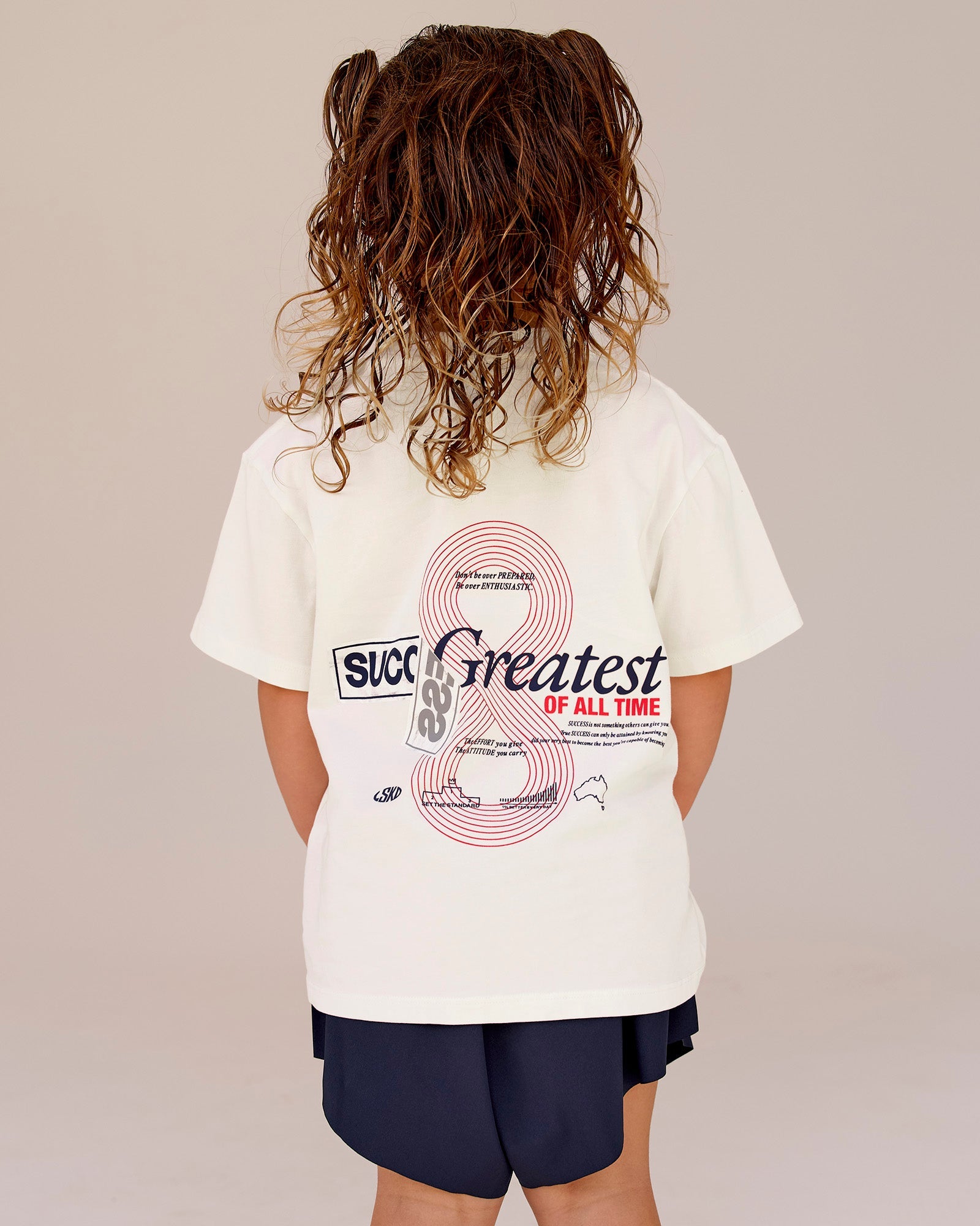 Studio image of Kids Greatest of All Time FLXCotton Tee - Off White Washed-Scarlet