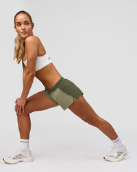 Woman wearing Accelerate 3" Mid-Rise Running Short - Pure Olive-Fog | Model:Xs | Size:ISSY | Thumbnail Index: 4