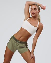 Woman wearing Accelerate 3" Mid-Rise Running Short - Pure Olive-Fog | Model:Xs | Size:ISSY | Thumbnail Index: 10