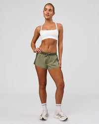 Woman wearing Accelerate 3" Mid-Rise Running Short - Pure Olive-Fog | Model:Xs | Size:ISSY | Thumbnail Index: 12
