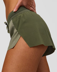 Woman wearing Accelerate 3" Mid-Rise Running Short - Pure Olive-Fog | Model:Xs | Size:ISSY | Thumbnail Index: 11