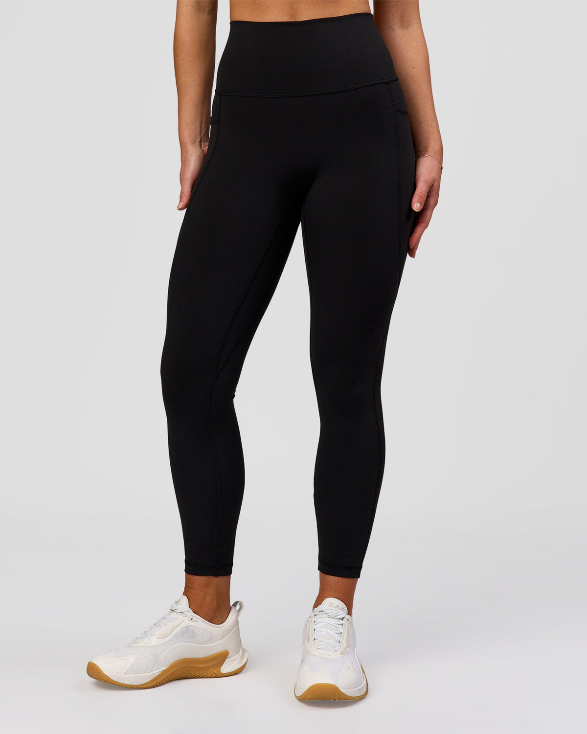 Woman wearing Fusion O.G Ultra High-Rise 7/8 Legging Pockets - Black | Model:Xs | Size:ISSY - view 1