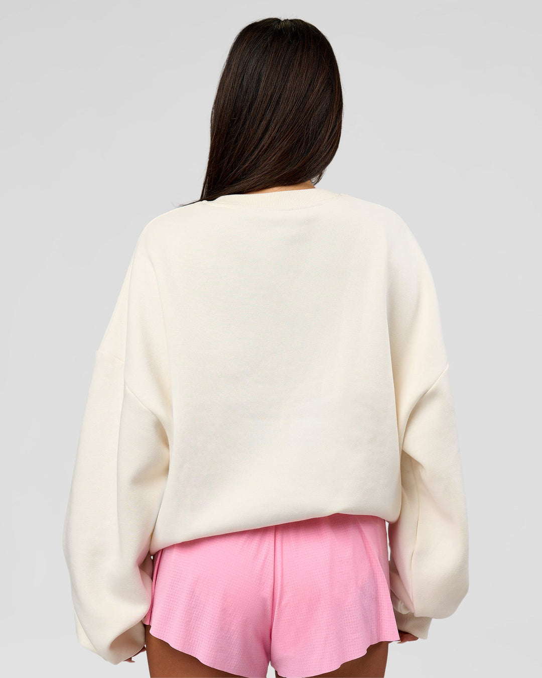 Woman wearing Varsity Boxy Crew - Off White-Pink Rose | Model:Bianca | Size:L - view 13