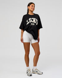 Woman wearing Varsity EST Heavyweight Oversized Tee  - Black-Off White | Model:Bianca | Size:L | Thumbnail Index: 9