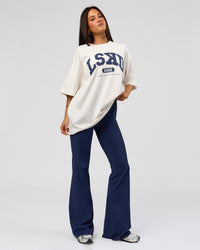 Woman wearing Varsity EST Heavyweight Oversized Tee  - Off White-Future Navy | Model:Bianca | Size:L | Thumbnail Index: 5
