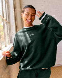Woman wearing Go-To Dual Oversized Sweater - Midnight Green-White | Model:Meg | Size:M | Thumbnail Index: 6