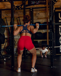 Woman wearing Fusion Ultra High-Rise 4" Short Pockets - Scarlet | Model:Tia | Size:M | Thumbnail Index: 13