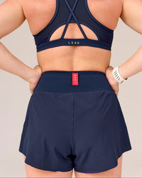 Woman wearing Tia-Clair Toomey-Orr Accelerate 3" Storage Running Short - Future Navy | Model:Tia | Size:M | Thumbnail Index: 13