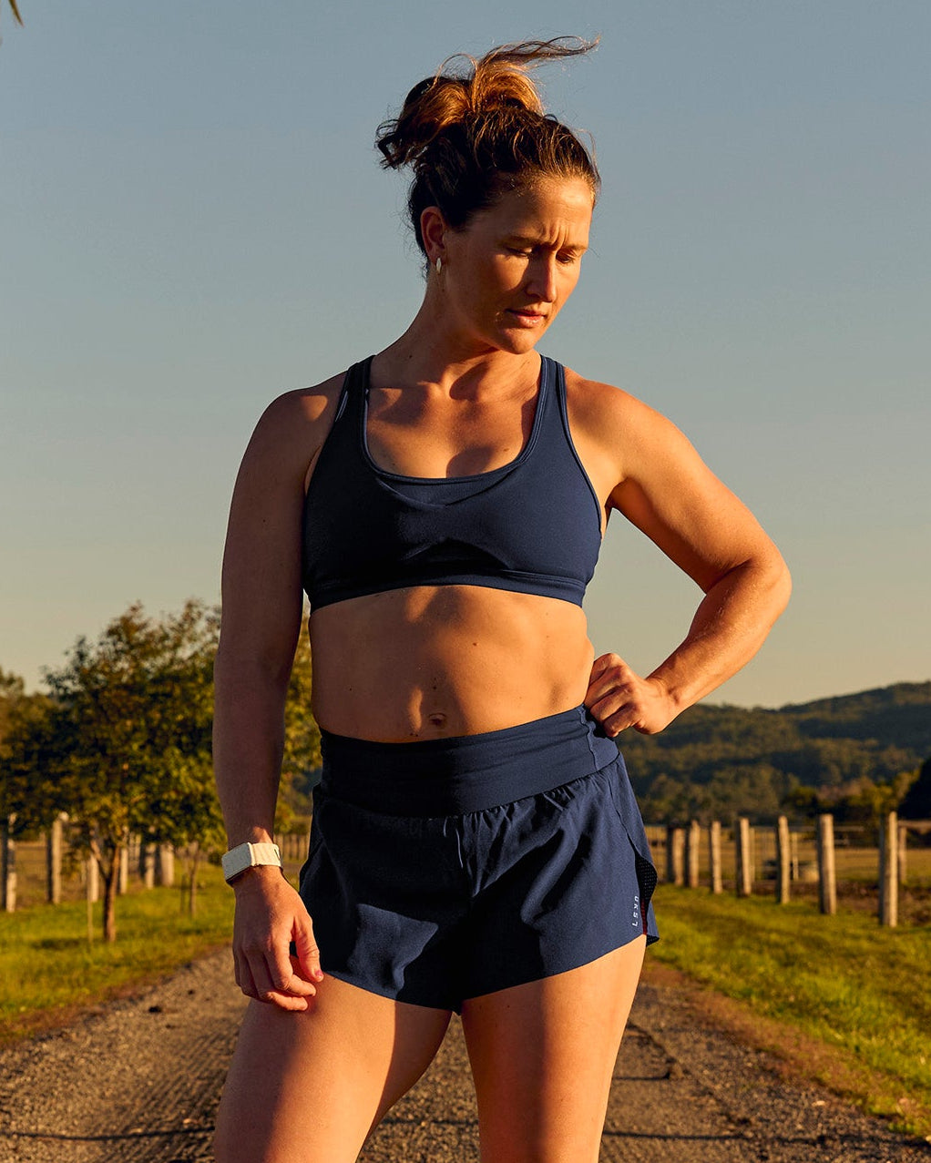 Woman wearing Tia-Clair Toomey-Orr Accelerate 3" Storage Running Short - Future Navy | Model:Tia | Size:M