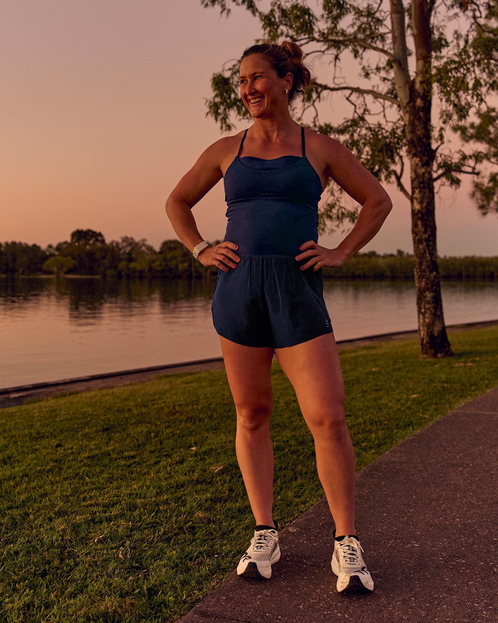 Woman wearing Tia-Clair Toomey-Orr Legacy 3" Run One-Piece - Future Navy | Model:Tia | Size:M