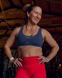 Woman wearing Unstoppable Racerback Sports Bra - Future Navy | Model:Tia | Size:M | Thumbnail Index: 1