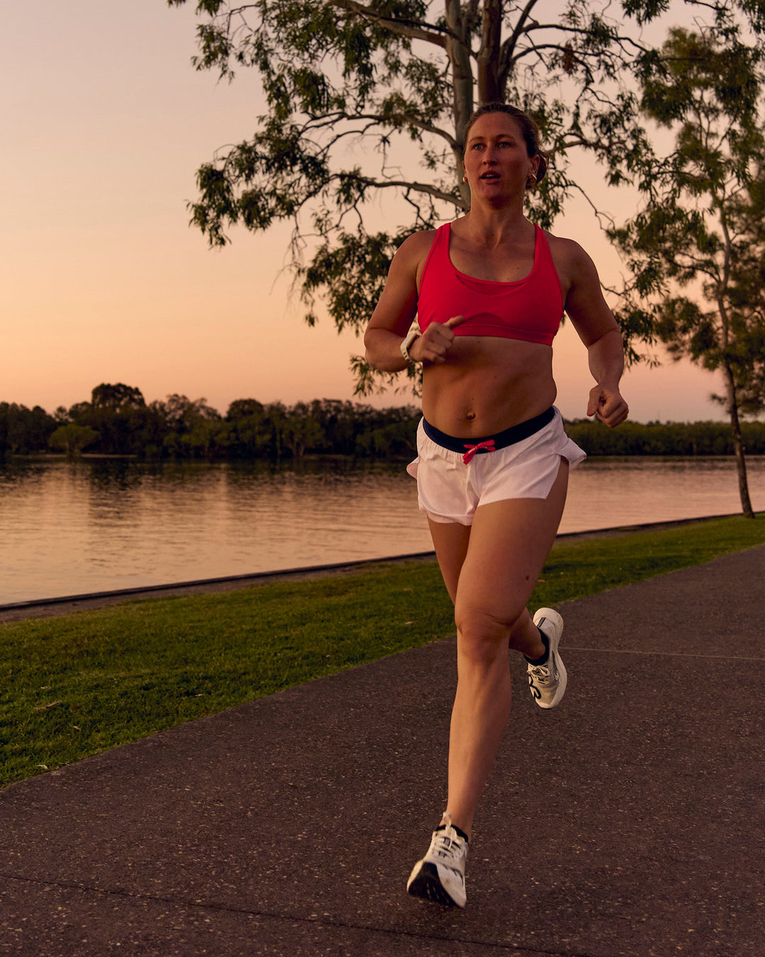 Woman wearing Unstoppable Racerback Sports Bra - Scarlet | Model:Tia | Size:M - view 14
