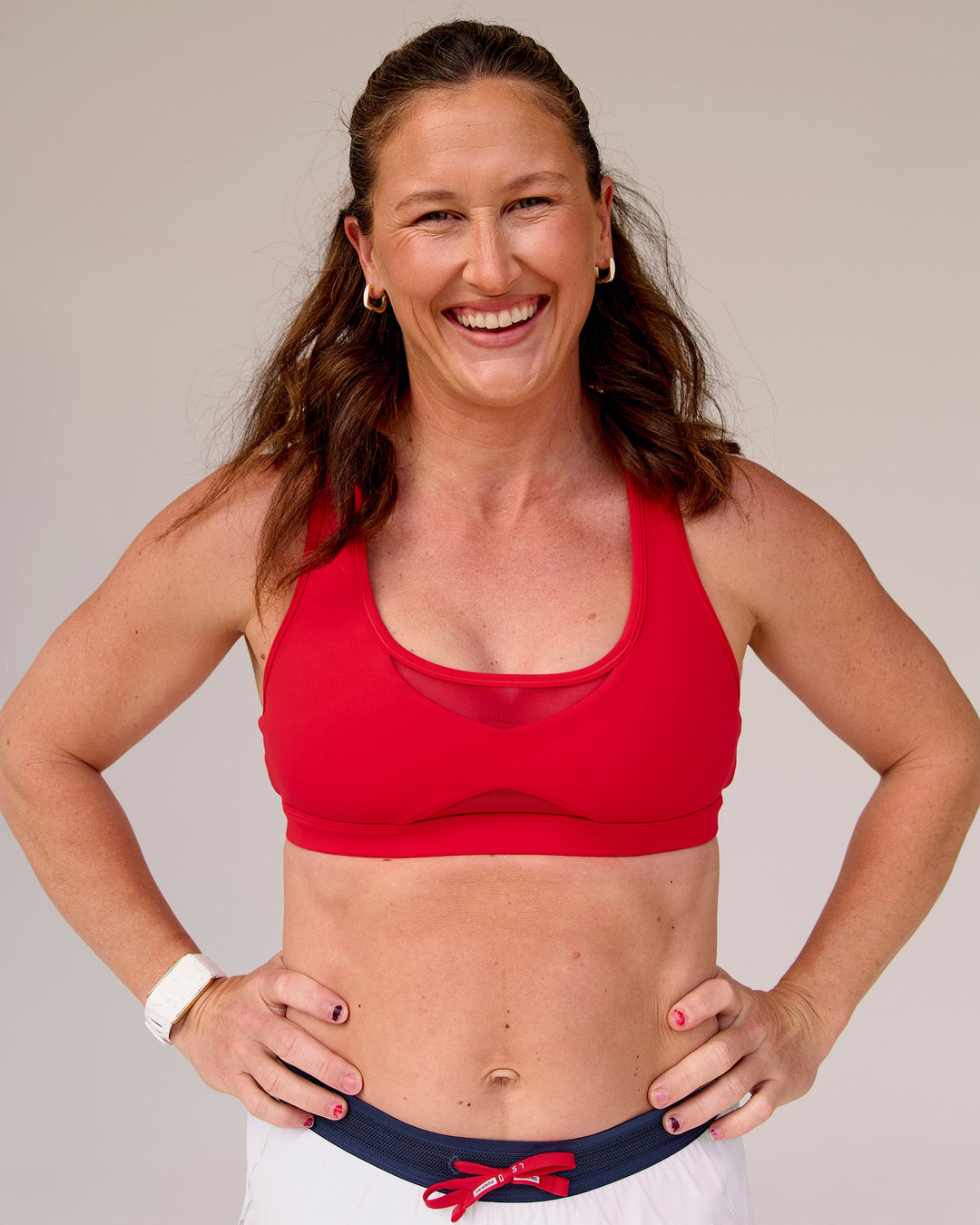 Woman wearing Unstoppable Racerback Sports Bra - Scarlet | Model:Tia | Size:M - view 3