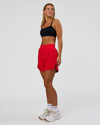 Woman wearing Challenger 5" Lined Performance Short - Scarlet | Model:Amity | Size:S | Thumbnail Index: 2