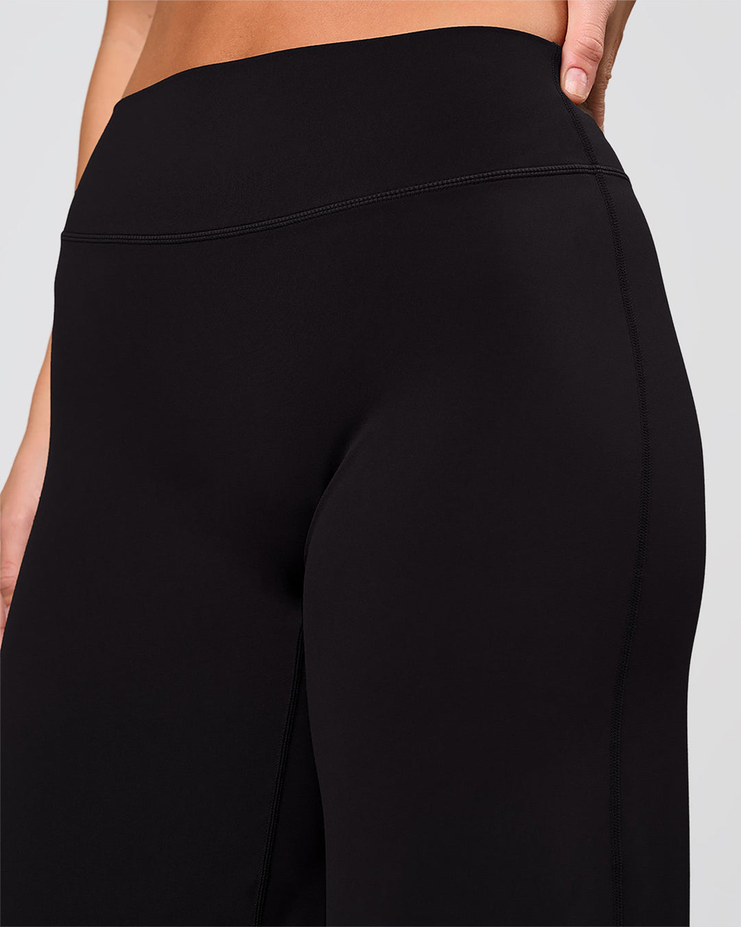Woman wearing Elixir High-Rise Pant - Black | Model:Amity | Size:S - view 4