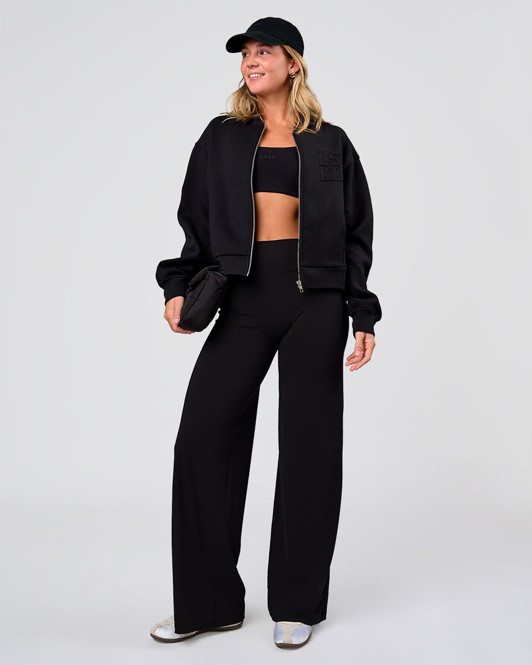 Woman wearing Elixir High-Rise Pant - Black | Model:Amity | Size:S - view 7