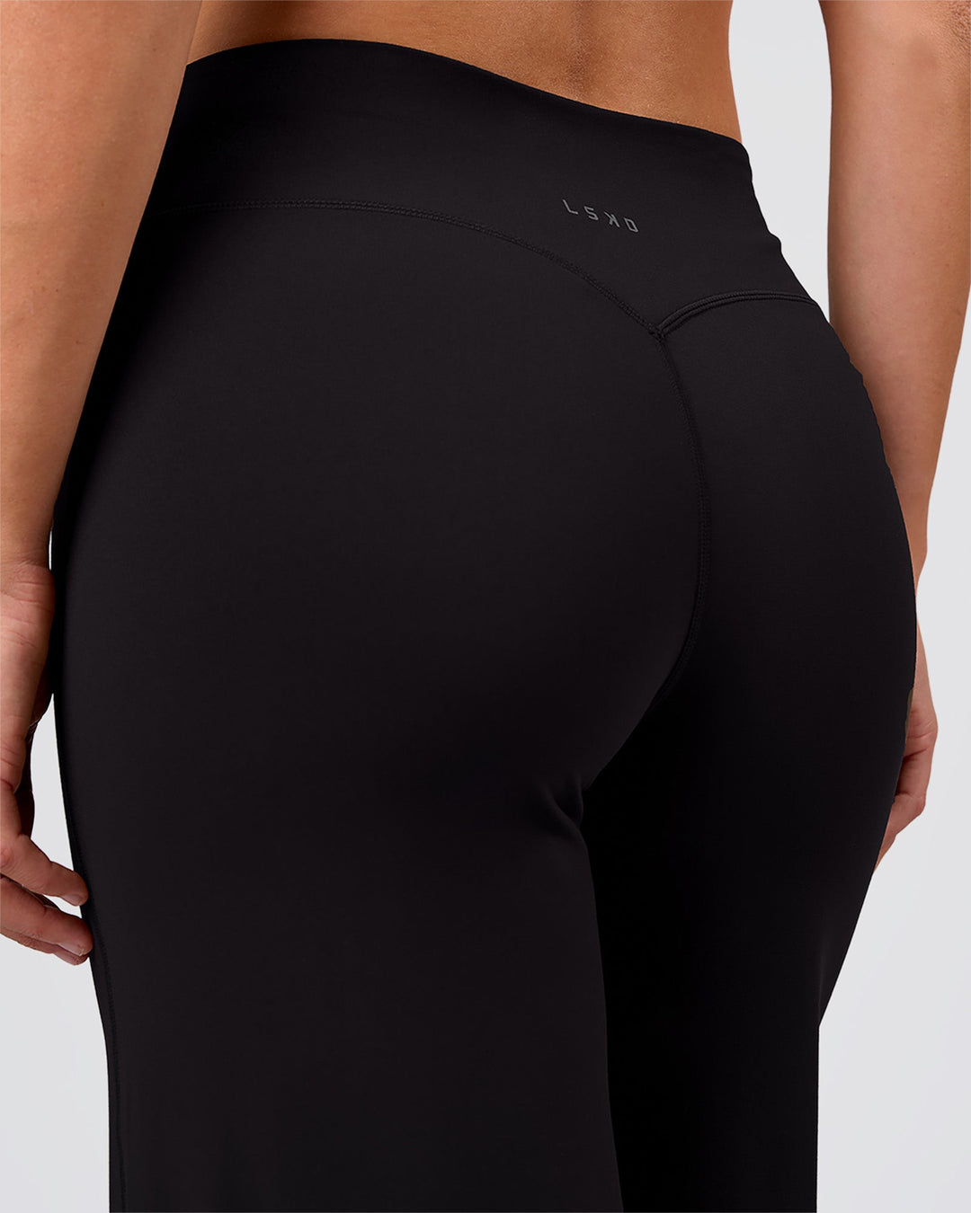 Woman wearing Elixir High-Rise Pant - Black | Model:Amity | Size:S - view 8