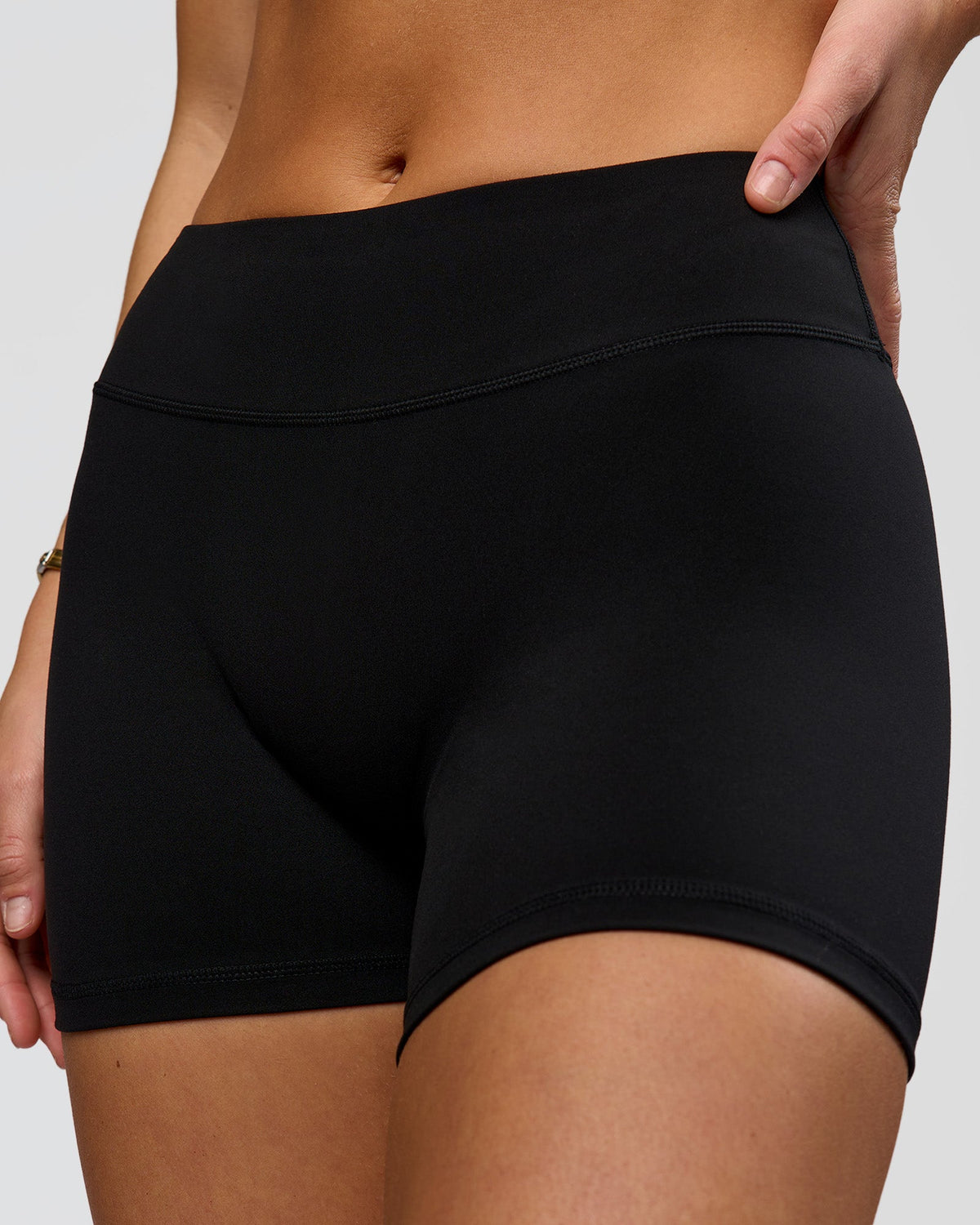 Woman wearing RXD Mid-Rise 4" Short - Black | Model:Amity | Size:S
