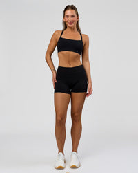 Woman wearing RXD Mid-Rise 4" Short - Black | Model:Amity | Size:S | Thumbnail Index: 4