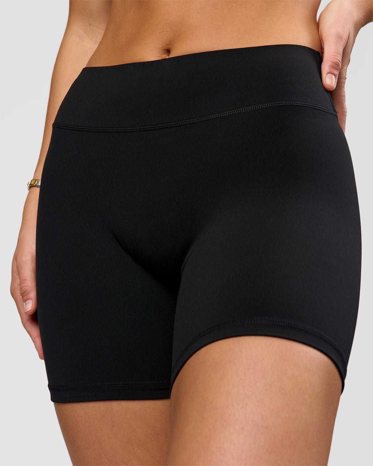 Woman wearing RXD Mid-Rise 6" Short - Black | Model:Amity | Size:S