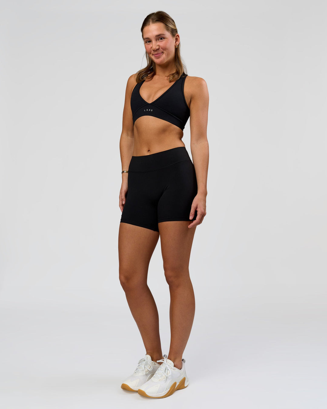 Woman wearing RXD Mid-Rise 6" Short - Black | Model:Amity | Size:S - view 4