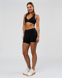 Woman wearing RXD Mid-Rise 6" Short - Black | Model:Amity | Size:S | Thumbnail Index: 3