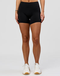Woman wearing RXD Mid-Rise 6" Short - Black | Model:Amity | Size:S | Thumbnail Index: 4